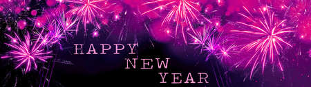Happy new Year fireworks background banner panorama greeting card - Colorful abstract pink firework with bokeh lights in the dark black nightの写真素材
