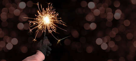 Silvester Party / New Year celebration festive background banner - Young happy pretty woman holding...