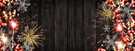 Silvester / New year background banner panorama - Sparklers, firework, bokeh lights and ice crystals...