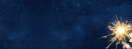 Silvester New Year Festival Party background banner panorama long- Sparkling sparklers in the dark blue night, New Year's Eveの写真素材