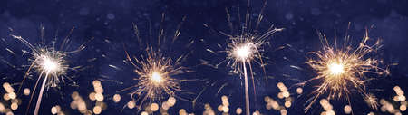 HAPPY NEW YEAR 2022 background banner greeting card - Firework, sparklers and bokeh lights and...
