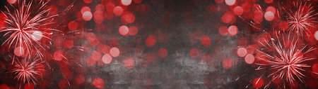 Silvester New Year Party Fireworks background banner panorama long- Abstract colorful red firework lights on black night texture, with space for text, New Year's Eveの写真素材