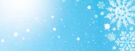snowflakes and ice crystals isolated on blue sky - winter background panorama banner long