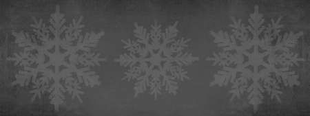 Festive winter / Christmas background banner panorama template greeting card - White ice crystals and snowflakes isolated on abstract dark black anthracite grey gray texture, with space for textの写真素材