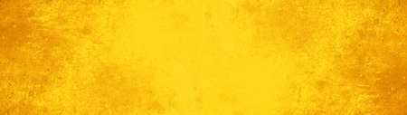 Dark abstract grunge yellow gold color colored painted watercolor stone concrete paper texture background banner, top viewの写真素材
