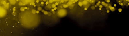 Abstract black yellow golden gold glittering festive dramatic bokeh glitter design celebration background banner panoramaの写真素材