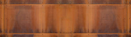Grunge rusty corten steel facade wall with rivets, rust metal texture background banner panorama