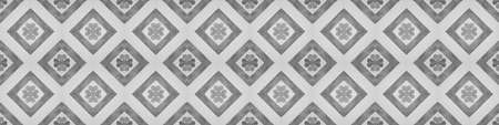 Old gray grey white vintage shabby patchwork mosaic tiles stone concrete cement wall texture background banner, with flower leaf rhombus diamond rue lozenge square print	
patternの写真素材