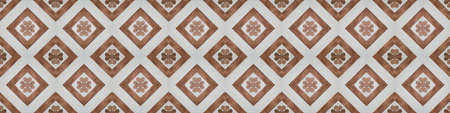 Old brown white vintage shabby patchwork mosaic tiles stone concrete cement wall texture background banner, with flower leaf rhombus diamond rue lozenge square print	
patternの写真素材