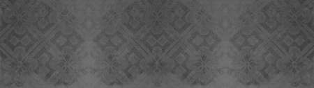 Old gray gray vintage shabby patchwork mosaic tiles tile stone concrete cement wall texture background banner panorama, with flower leaf rhombus diamond rue lozenge square print patternのeditorial素材