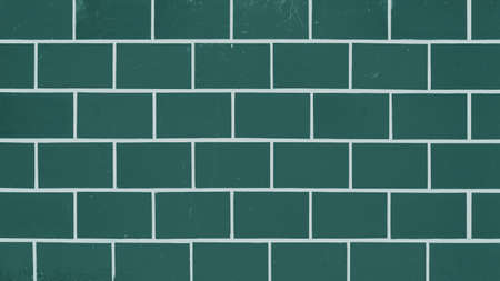 Green abstract colored colorful brick tiles tilework glazed ceramic wall or floor texture wide background patternの写真素材