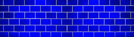 Blue abstract colored colorful brick tiles tilework glazed ceramic wall or floor texture wide background banner panorama patternの写真素材