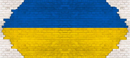 Cracked Flag of Ukraine - peace, against war - Abstract yellow blue colored painted damaged rustic brick wall brickwork stonework masonry texture background banner panorama pattern template architecture, with cracksの写真素材