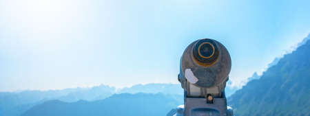 Binoculars telescope in the mountains alps in the Kleinwalsertal in Austria with a great viewの写真素材