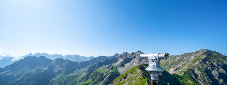 Binoculars telescope in the mountains alps in the Kleinwalsertal in Austria with a great viewの写真素材
