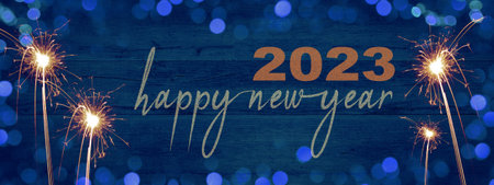 Frame of lights bokeh golden flares and sparkler isolated on rustic abstract blue wooden texture -...