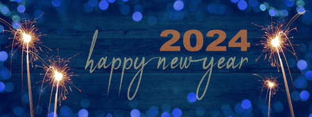 Frame of lights bokeh golden flares and sparkler isolated on rustic abstract blue wooden texture - Holiday New Year's Eve Silvester New Year Party 2024 festive background banner greeting cardの写真素材