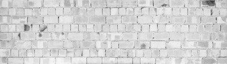White gray light damaged rustic brick wall brickwork stonework masonry texture background banner panorama patternの写真素材