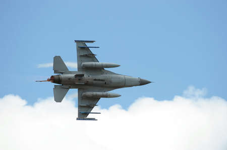 F-16 Fighting Falcon military jet with afterburnerの写真素材