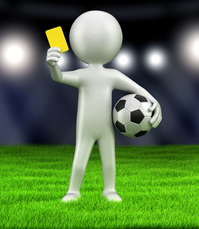 Referee holds up yellow cardの写真素材
