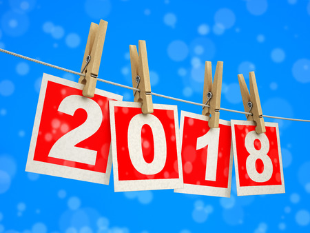 Clothespins on rope with 2018. Image with clipping path