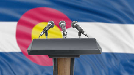 Podium lectern with microphones and Colorado flag in backgroundの写真素材