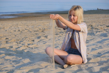 Girl plays sand.の写真素材