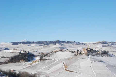 View of Langhe hills with snow and the village of Castiglion Falletto, Piedmont - Italyのeditorial素材