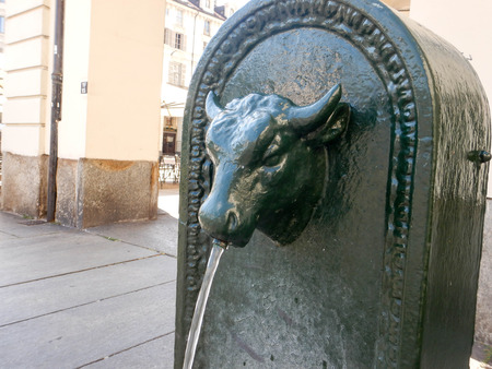 Old fountain in the city of Turin to drink. Piedmont - Italyの写真素材