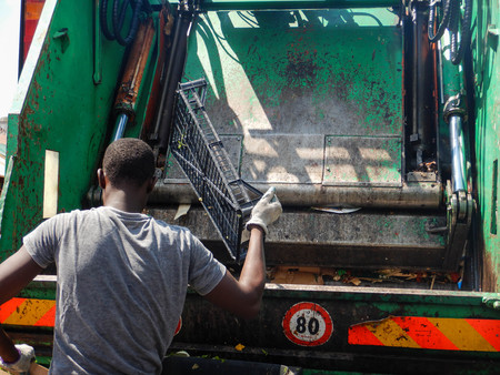 Waste trucks and bins at the market of Turinの写真素材