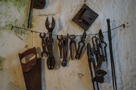 Old tools working in a cave house in Materaの写真素材