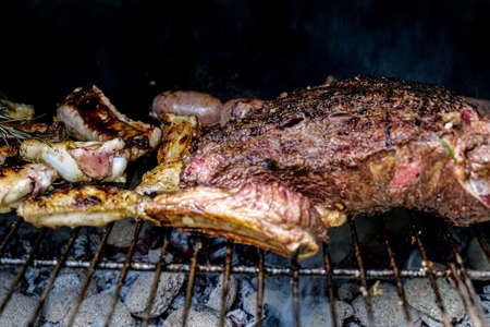 Appetizing cooking of meat on the grillの写真素材