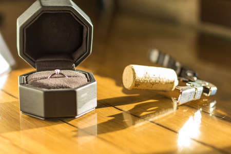 First view of a corkscrew and engagement ring