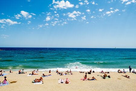 People relaxing on the beach in Palma de Mallorca, Balearic islands, Spainの写真素材
