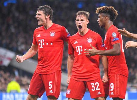 LONDON, ENGLAND - OCTOBER 1, 2019: Joshua Kimmich of Bayern celebrates with Benjamin Pavard of Bayern and Kingsley Coman of Bayern after he scored a goal during the 2019/20 UEFA Champions League Group B game between Tottenham Hotspur FC (England) and Bayeのeditorial素材