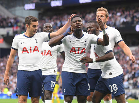LONDON, ENGLAND - SEPTEMBER 28, 2019: Tanguy Ndombele of Tottenham celebrates with Serge Aurier of Tottenham after he scored a goal during the 2019/20 Premier League game between Tottenham Hotspur FC and Southamtpon FC at Tottenham Hotspur Stadium.のeditorial素材