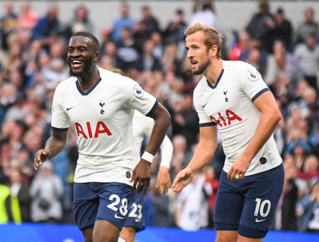 LONDON, ENGLAND - SEPTEMBER 28, 2019: Tanguy Ndombele of Tottenham (L) celebrates with Harry Kane of Tottenham (R) after he scored a goal during the 2019/20 Premier League game between Tottenham Hotspur FC and Southamtpon FC at Tottenham Hotspur Stadium.のeditorial素材