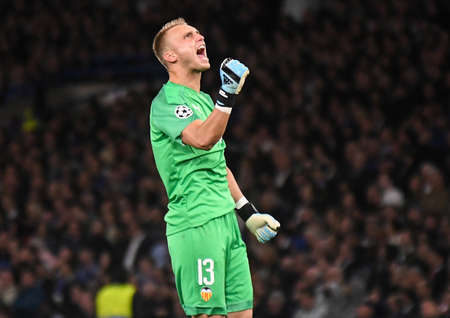 LONDON, ENGLAND - SEPTEMBER 17, 2019: Jasper Cillessen of Valencia celebrates after a goal scored by Rodrigo Moreno Machado of Valencia (not in the picture) during the 2019/20 UEFA Champions League Group H game between Chelsea FC (England) and Valencia CFのeditorial素材
