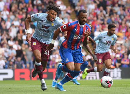 LONDON, ENGLAND - AUGUST 31, 2019: Tyrone Mings of Villa (L) and Jordan Ayew of Palace (R) pictured during the 2019/20 Premier League game between Crystal Palace FC and Aston Villa FC at Selhurst Park.のeditorial素材