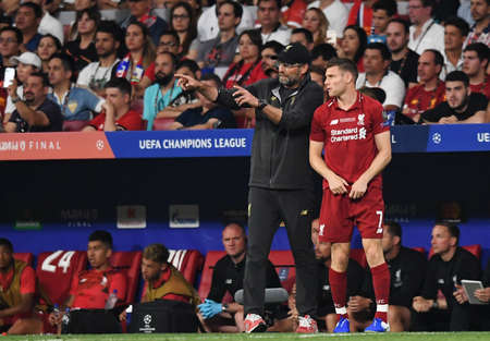 MADRID, SPAIN - JUNE 1, 2019: Liverpool manager Jurgen Klopp (L) and James Milner of Liverpool (R) pictured during the 2018/19 UEFA Champions League Final between Tottenham Hotspur (England) and Liverpool FC (England) at Wanda Metropolitano.のeditorial素材