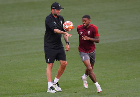 MADRID, SPAIN - MAY 31, 2019: Liverpool manager Jurgen Klopp (L) and Georginio Wijnaldum of Liverpool (R) pictured during a training session held one day before the 2018/19 UEFA Champions League Final between Tottenham Hotspur (England) and Liverpool FC (のeditorial素材