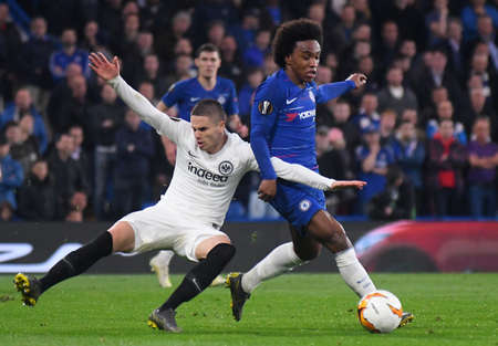 LONDON, ENGLAND - MAY 9, 2019: Willian Borges da Silva of Chelsea (R) pictured during the second leg of the 2018/19 UEFA Europa League Semi-Finals game between Chelsea FC (England) and Eintracht Frankfurt e.V. (Germany) at Stamford Bridge.のeditorial素材