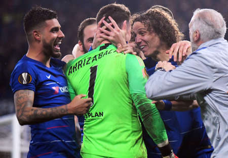 LONDON, ENGLAND - MAY 9, 2019: Emerson Palmieri dos Santos of Chelsea (L), Kepa Arrizabalaga of Chelsea (C) and David Luiz of Chelsea (R) celebrate after the second leg of the 2018/19 UEFA Europa League Semi-Finals game between Chelsea FC (England) and Eiのeditorial素材