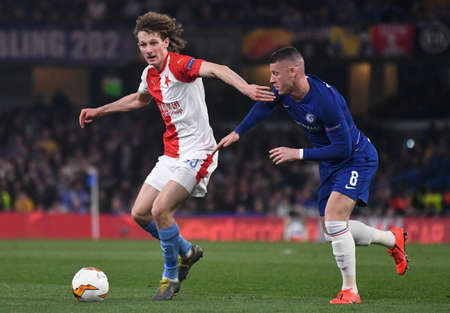 LONDON, ENGLAND - APRIL 18, 2019: Alex Kral of Slavia and Ross Barkley of Chelsea pictured during the second leg of the 2018/19 UEFA Europa League Quarter-Finals game between Chelsea FC (England) and SK Slavia Praha (Czech Republic) at Stamford Bridge.のeditorial素材
