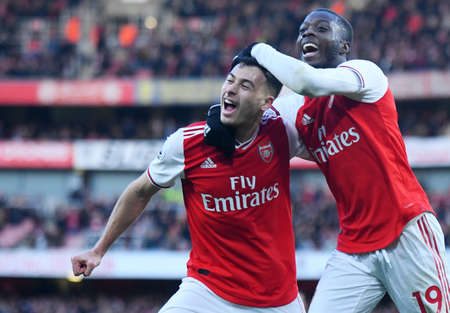 LONDON, ENGLAND - JANUARY 18, 2020: Gabriel Martinelli of Arsenal and Nicolas Pepe of Arsenal celebrate a goal scored during the 2019/20 Premier League game between Arsenal FC and Sheffield United FC at Emirates Stadium.のeditorial素材