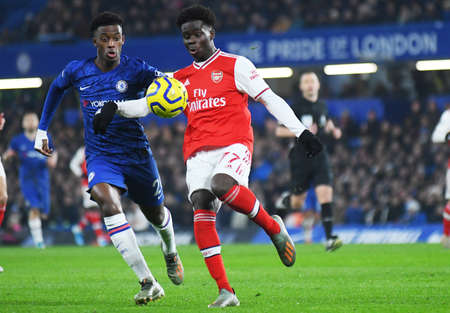 LONDON, ENGLAND - JANUARY 21, 2020: Callum Hudson-Odoi of Chelsea and Bukayo Saka of Arsenal pictured during the 2019/20 Premier League game between Chelsea FC and Arsenal FC at Stamford Bridge.のeditorial素材