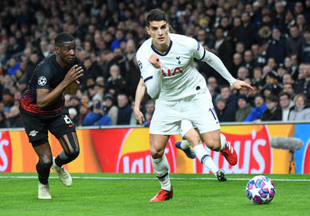 LONDON, ENGLAND - FEBRUARY 19, 2020: Nordi Mukiele of Leipzig and Erik Lamela of Tottenham pictured during the first leg of the 2019/20 UEFA Champions League Round of 16 game between Tottenham Hotspur FC and RB Leipzig at Tottenham Hotspur Stadium.のeditorial素材