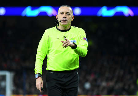 LONDON, ENGLAND - FEBRUARY 19, 2020: Turkish FIFA referee Cuneyt Cakir  pictured during the first leg of the 2019/20 UEFA Champions League Round of 16 game between Tottenham Hotspur FC and RB Leipzig at Tottenham Hotspur Stadium.のeditorial素材