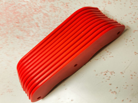 Red fabricated PET-G plastic with debris around it from routing the edges and with copy space.の写真素材