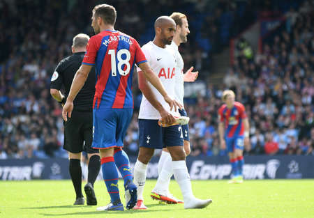 LONDON, ENGLAND - SEPTEMBER 11, 2021: James McArthur returns Lucas Moura his boot during the 2021/22 Premier League matchweek 4 game between Crystal Palace FC and Tottenham Hotspur.のeditorial素材